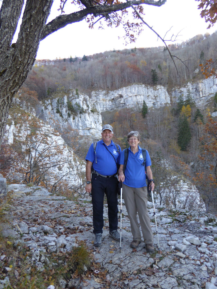 Walk on the Sunday was to the Saleve above le Coin.  Walking up through the forest to the grotte d'Orjobet over the top and down la Grande Gorge. Mike Goodyer with Pam Harris sporting ABMSAC polo shirts overlooking the gorge. Photo by Alan Norton